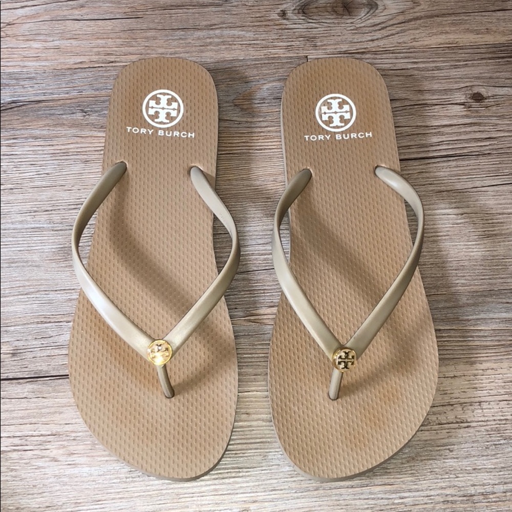Tan Tory Burch flip flops.